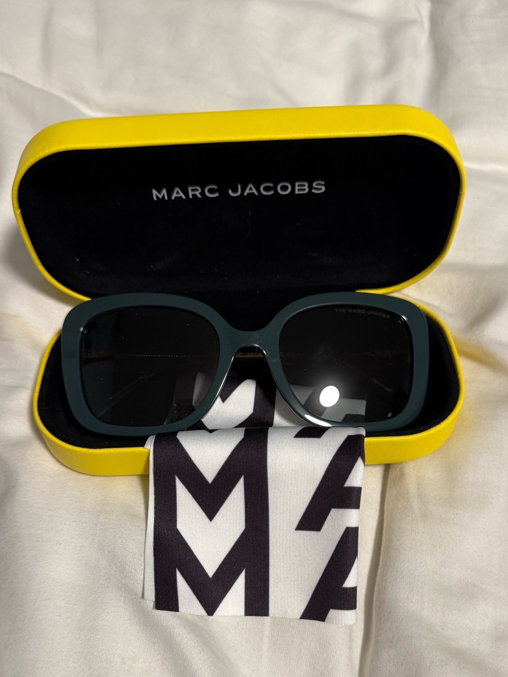Marc Jacobs Woman’s Dark Teal Square Sunglasses with alternating pink hues! New